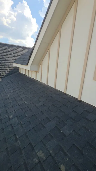 Board and batten siding at a gable and roof intersection