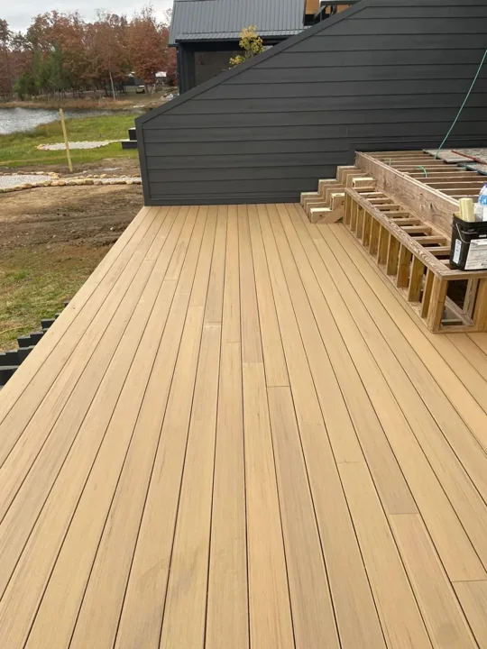 Deck flooring with the next level and stair framing in progress