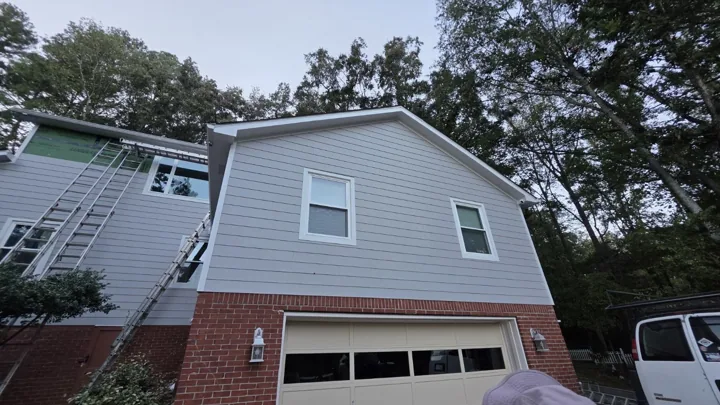 Siding and trim above a garage during installation