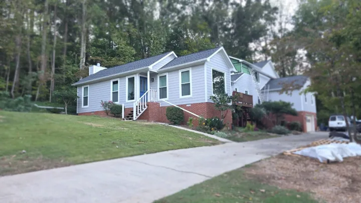Gray lap siding and white exterior trim