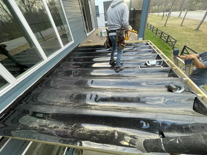 Trex RainEscape drainage installation before the deck boards go down
