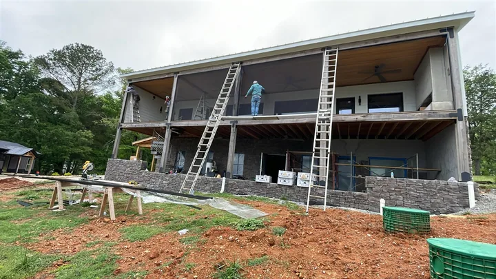 Installing wide screen panels on an elevated porch