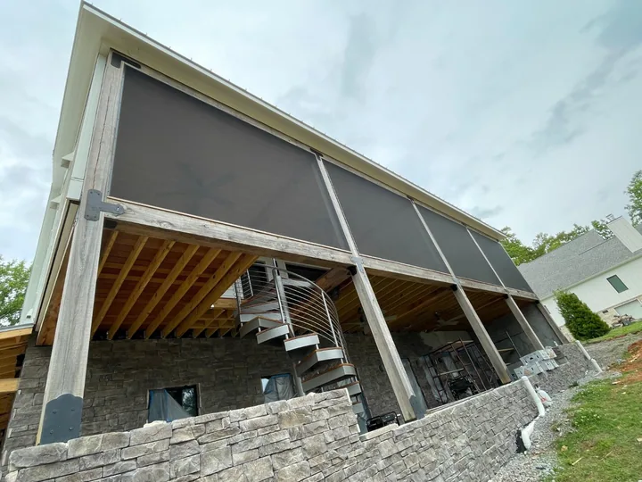 Wide screen panels along an elevated porch