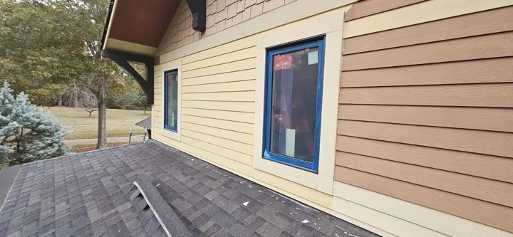 New lap siding and trim around the windows, before painting