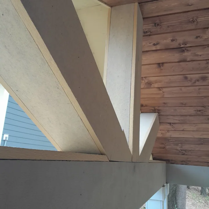 Trim detail where the wood porch ceiling meets the perimeter